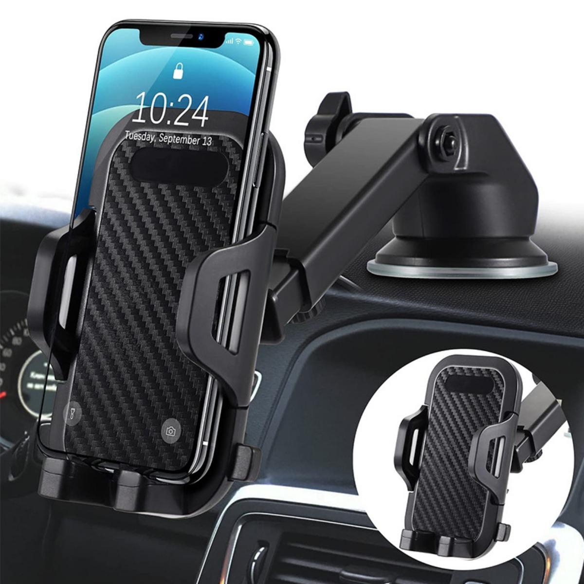 Black car phone holder mounted on car dashboard with smartphone secured in cradle, suction cup base attached, in-car lifestyle view